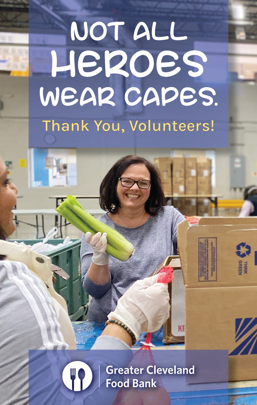 Not all heroes wear capes: a volunteer smiles while packaging vegetables at the Food Bank.